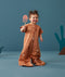 Toddler wearing an ergoPouch Sleep Suit Bag 1.0 TOG Sunny