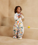 Preschooler wearing a warm, ergoPouch Sleep Suit Bag 3.5 TOG Fruit Salad