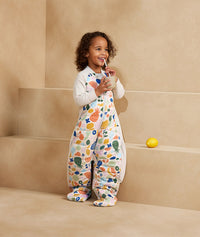 Preschooler wearing an ergoPouch Sleep Suit Bag 2.5 TOG Fruit Salad