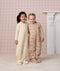 Two preschoolers standing side-by-side in full-length quilted Sleep Suit bags 2.5 TOG, smiling with an arm around each other.