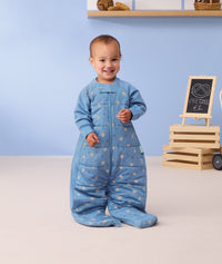 Toddler wearing a TOG-rated ergoPouch sleep suit bag, made from organic, breathable materials.