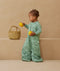 Toddler wearing a warm, ergoPouch Sleep Suit Bag 3.5 TOG Sweet Orchard