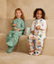 Two preschool kids wearing a sleeved ergoPouch sleep suit bag, made from organic, premium materials gentle on skin.