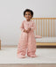 Toddler wearing a warm, ergoPouch Sleep Suit Bag 3.5 TOG Daisies