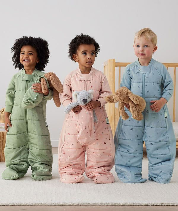 Toddler wearing an ergoPouch Sleep Suit Bag 2.5 TOG Dragonflies