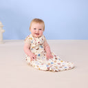 Baby smiling wearing ergoPouch Sleeping Bag 0.2 TOG in Bon Appetit