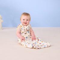 Baby smiling wearing ergoPouch Sleeping Bag 0.2 TOG in Bon Appetit