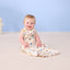 Baby smiling wearing ergoPouch Sleeping Bag 0.2 TOG in Bon Appetit
