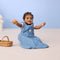 Infant child wearing ergoPouch Sleeping Bag in Petit Pretzel