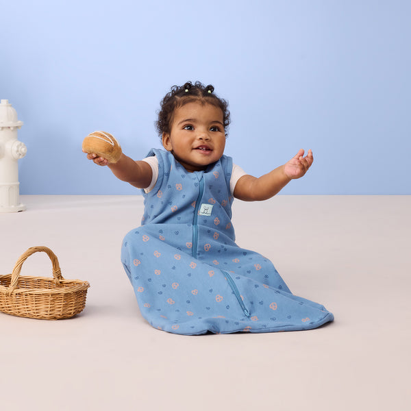 Infant child wearing ergoPouch Sleeping Bag in Petit Pretzel