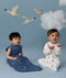 Two children sitting in ergoPouch ergoPouch Long Sleeve Layer 1.0 TOG Daydream and Sleeping Bag 1.0 TOG Starbeam