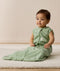 Infant wearing an ergoPouch Sleeping Bag 1.0 TOG Willow