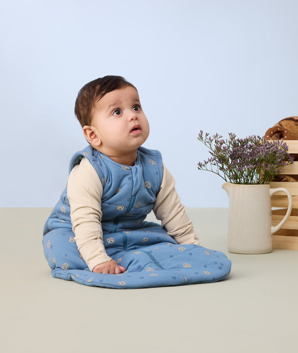 ergoPouch baby sleeping bag in blue, TOG-rated and made from organic materials for comfort.