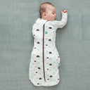 Baby wearing a Cocoon Swaddle Bag 1.0 TOG Clouds, with one arm out