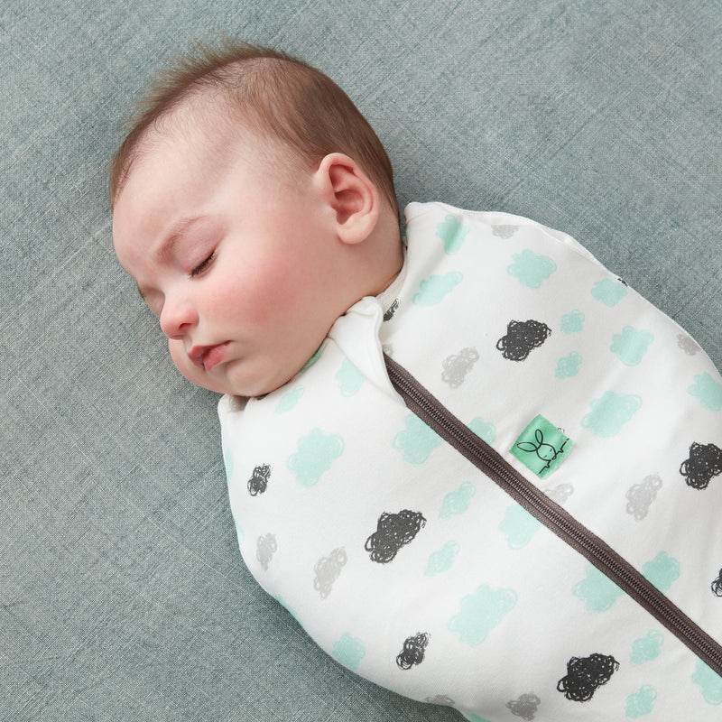 Sleeping baby wearing a Cocoon Swaddle Bag 1.0 TOG
