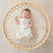 Baby wearing an ergoPouch Cocoon Swaddle Bag 1.0 TOG Fawn, with arms out