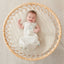 Baby wearing an ergoPouch Cocoon Swaddle Bag 1.0 TOG Fawn, with arms out