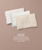 Small toddler pillow featuring a plain white insert, a smooth white protector, and a cream pillowcase with a subtle pattern. Text below reads 