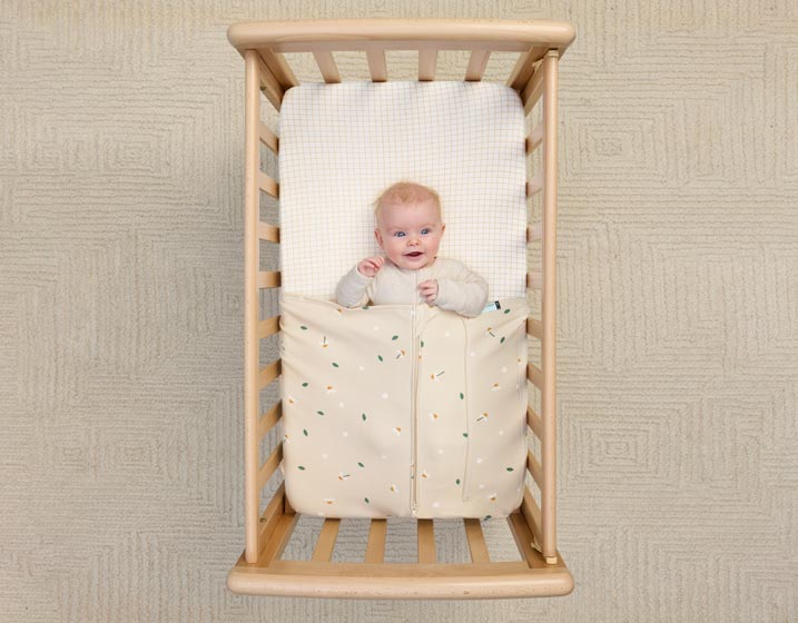 Baby is secured and safe with the form-fitted ergoPouch Tuck Sheet.