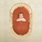 Baby lying under ergoPouch HugMe Blanket 0.2 & 1.0 TOG in Rust 