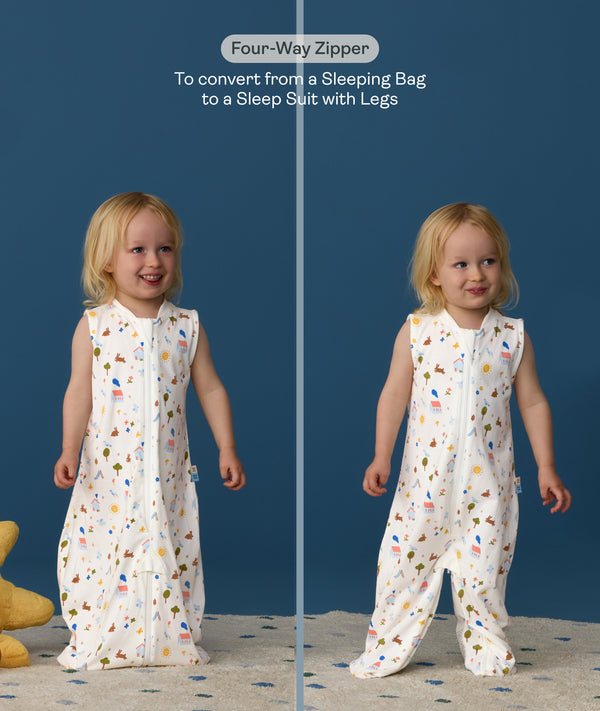 Child wearing ergoPouch Jersey Sleep Suit Bag 0.2 TOG Daydream, featuring a four-way zipper, convertible from a sleeping bag to a sleep suit with legs.