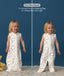 Child wearing ergoPouch Jersey Sleep Suit Bag 0.2 TOG Daydream, featuring a four-way zipper, convertible from a sleeping bag to a sleep suit with legs.