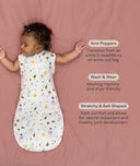 Benefits of a cocoon swaddle transitioning to arms out sleeping, featuring an ergoPouch Cocoon Swaddle Bag 1.0 TOG Daydream