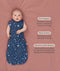 Benefits of a cocoon swaddle transitioning to arms out sleeping, featuring an ergoPouch Cocoon Swaddle Bag 1.0 TOG Starbeam