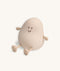 Soft-touch silicone bedtime lamp in the shape of a rounded character with a smiling face, small arms, and legs, sitting against a plain light background.