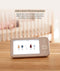 ergoPouch Drift Home Baby Monitor and Smart TOG Guide, displaying  clothing recommendations from the room temperature