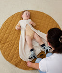 Baby with hip dysplasia wearing ergoPouch Hip Harness Jersey Sleep Bag 0.2 TOG Oatmeal Marle