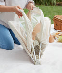 Folding the ergoPouch Easy Sleep Portable Crib Ecru