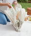 Folding the ergoPouch Easy Sleep Portable Crib Ecru