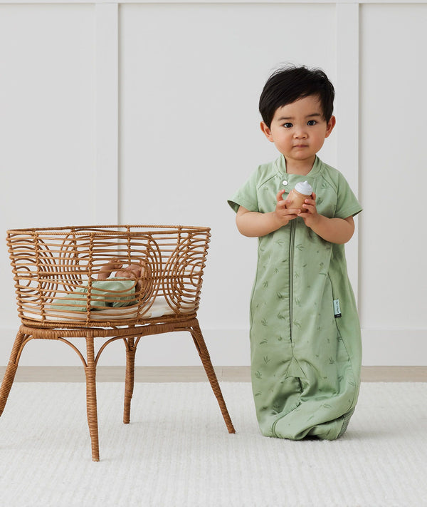 Toddler wearing an ergoPouch Sleep Suit Bag 1.0 TOG Willow