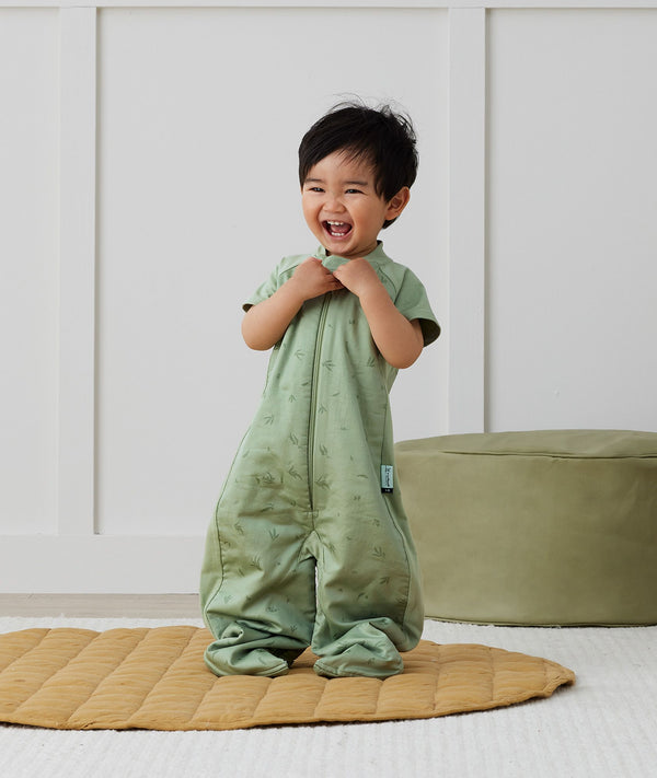 Toddler wearing an ergoPouch Sleep Suit Bag 1.0 TOG Willow