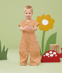 Toddler wearing an ergoPouch Sleep Suit Bag 1.0 TOG Honey Bees