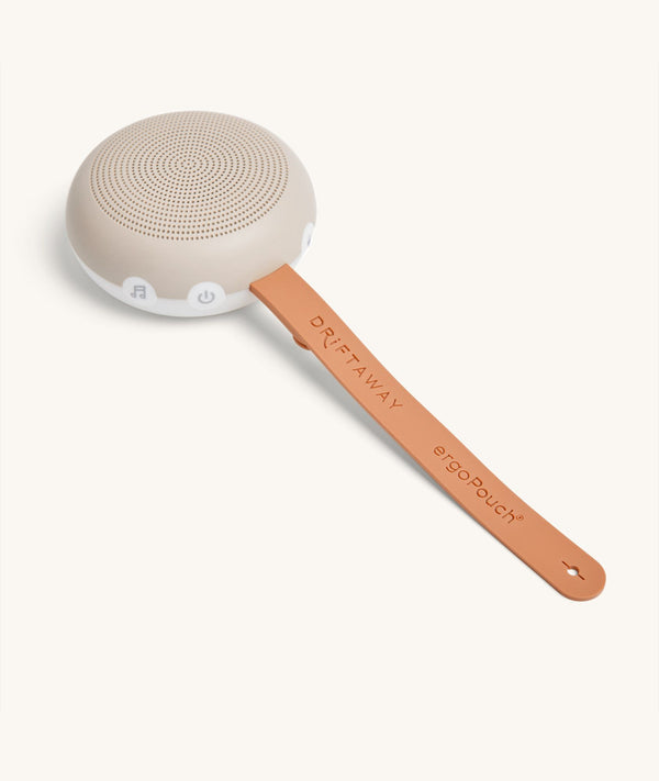 Strap open and extended on the ergoPouch Drift Away White Noise Machine Taupe